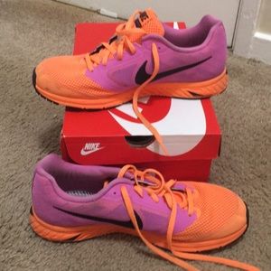 Pink and orange lightweight running shoes